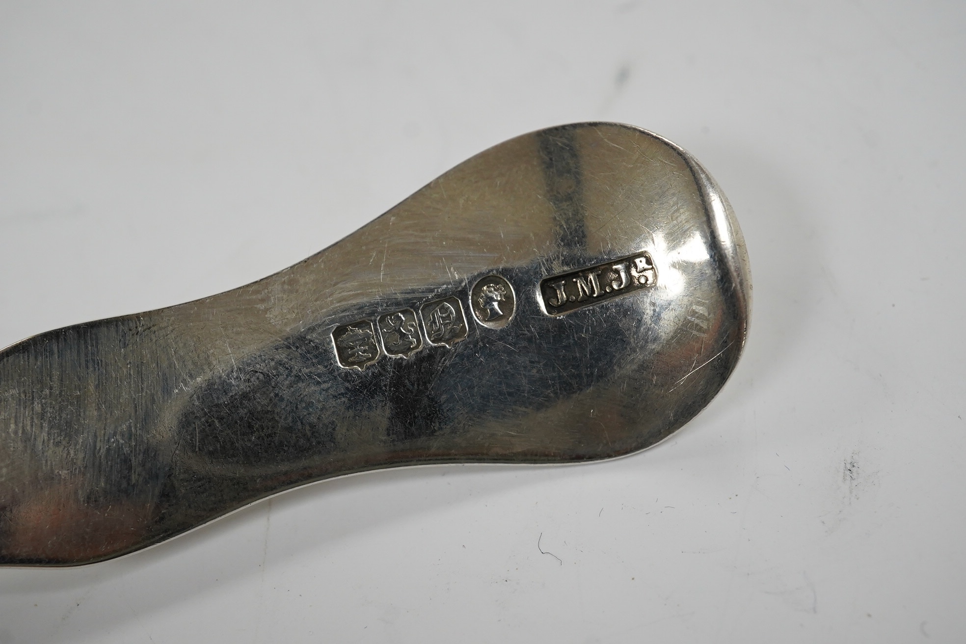 An early George III silver Old English feather edge pattern soup ladle, George Baskerville, London, 1766, together with a Victorian Scottish silver sauce ladle, 6.1 oz. Condition - poor to fair